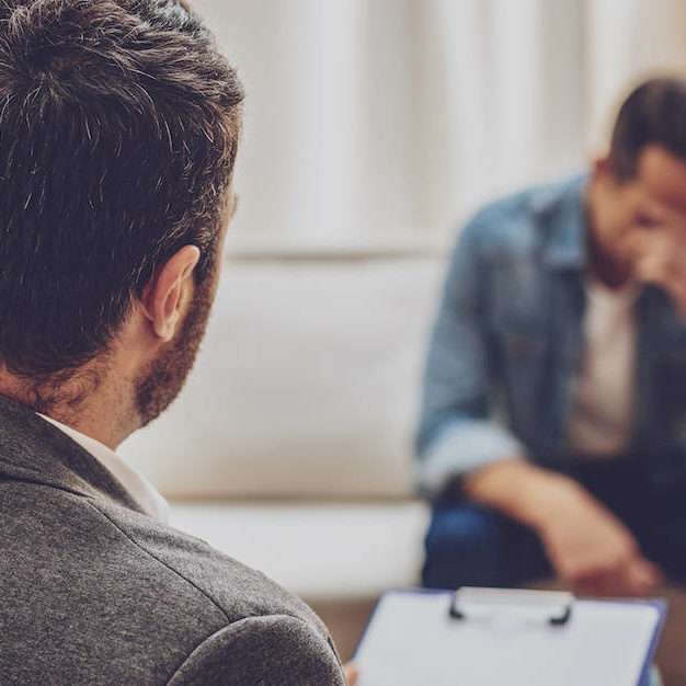 Upset male person being deep in thoughts when should you talk to a therapist and how to find the right one