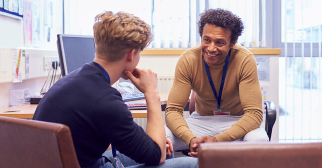 Male College Student Meeting With Campus Counselor Discussing Mental Health Issues finding the right therapist