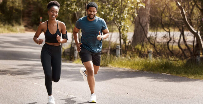 Health, exercise and black couple running, nature and workout goal with endurance, training and wellness. Runners, man and woman in the street, run and progress with health, performance and fitness how exercise can help with stress