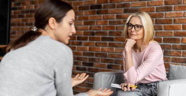 Image of a female therapist and a worried patient signs it's time to see a therapist