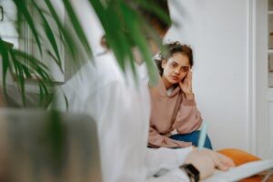 person discussing depression care with therapist