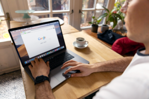 person using laptop to search provider portal in bright room
